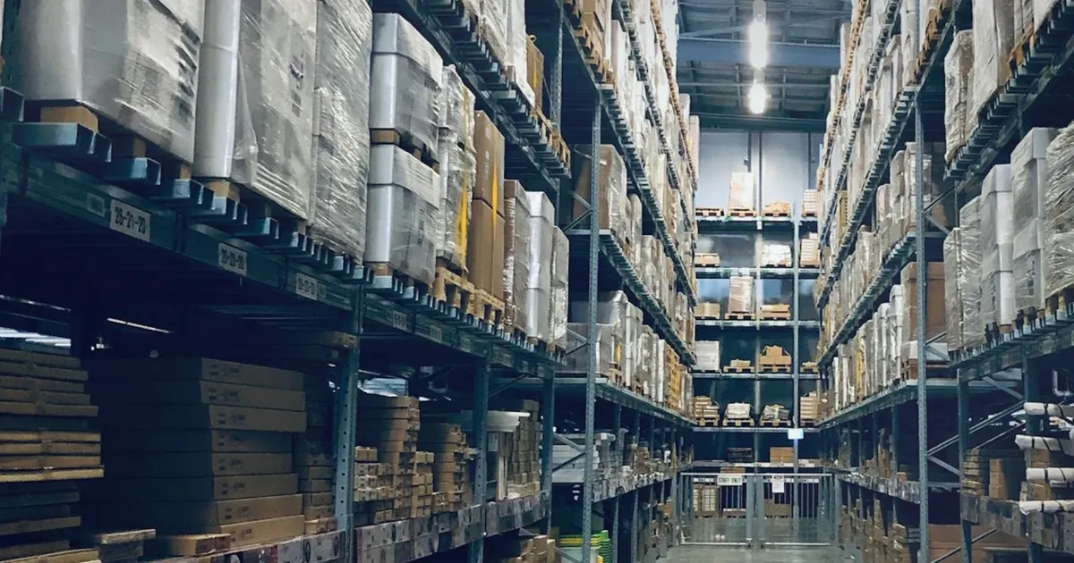 Realistic warehouse aisle with stocked shelves and cool industrial lighting, uniquely composed for We Mean Business Poll Puts...