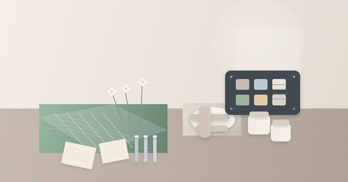 Beauty merchandising desk with green silk swatches, a sandal, skincare jars and a tablet