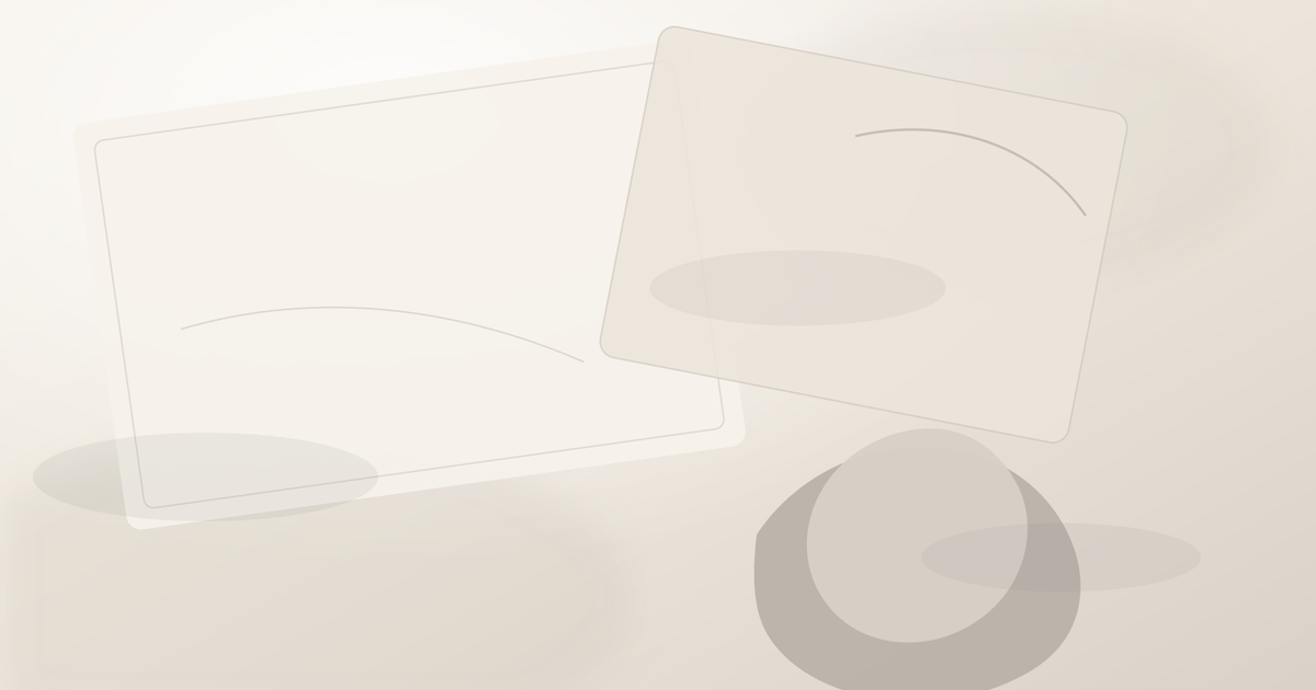 Abstract stone and paper forms with soft mineral shadows arranged like an editorial desk